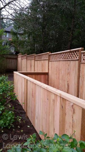 Custom built cedar solid style fence with lattice top & utility area at Portland Oregon fence installation job we did 