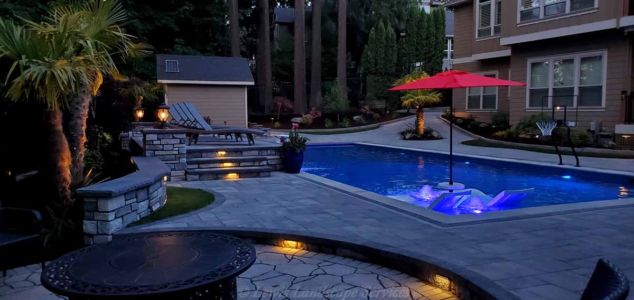 Mixture of Tree Uplighting, Hardscape Lights, Post Lights & Pool Lighting from one of our Installations in Beaverton